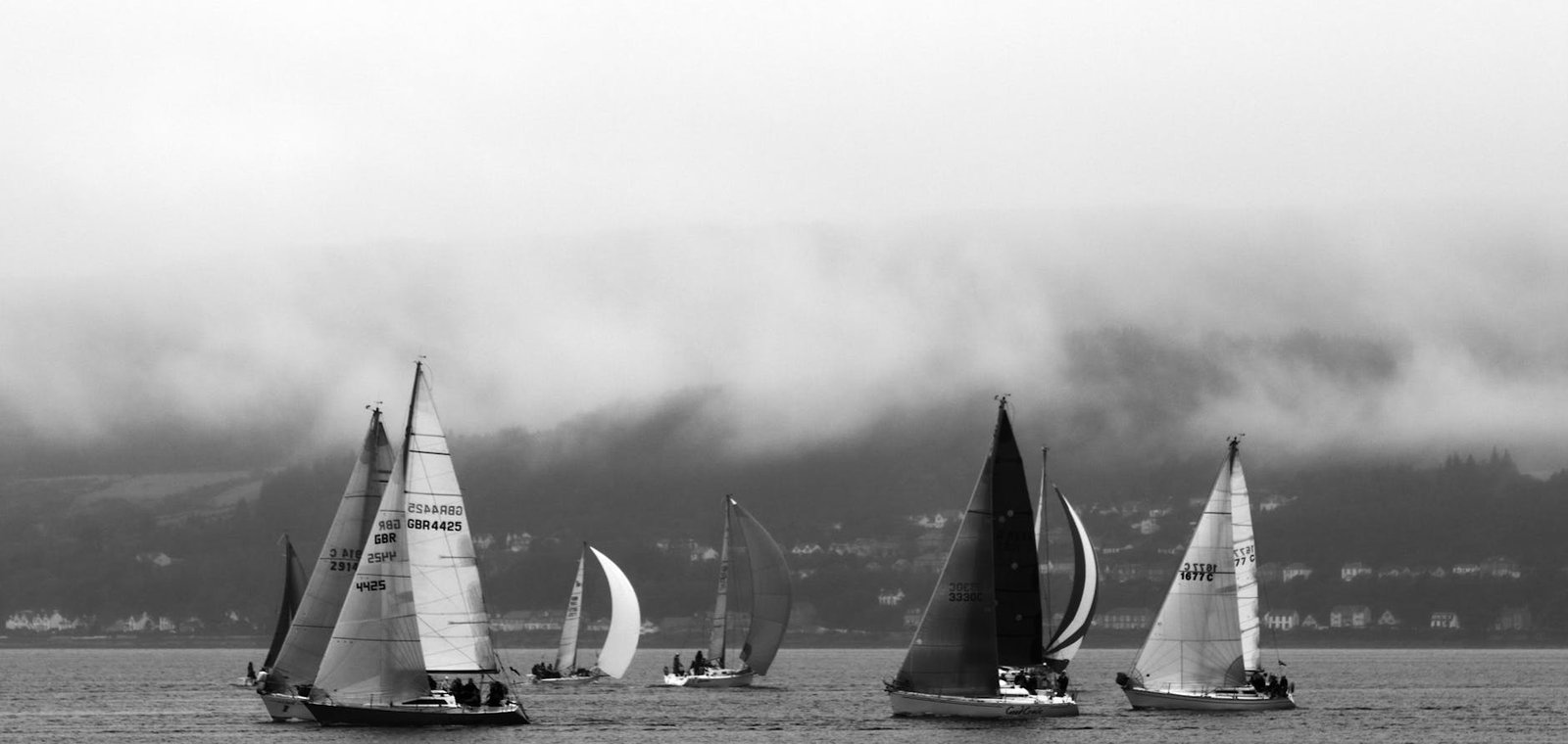 grayscale photo of sailboats